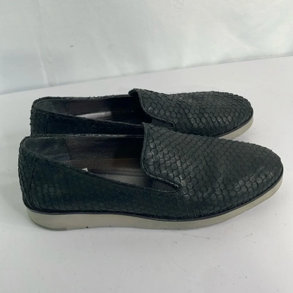 Johnston and Murphy, 781-1545. Texturized black leather loafers with gray soles.